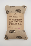 Hedgehog print microwavable lavender wheat bag flat lay on white background