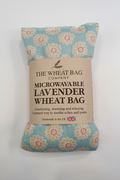Daisy print microwavable lavender wheat bag flat lay on white background