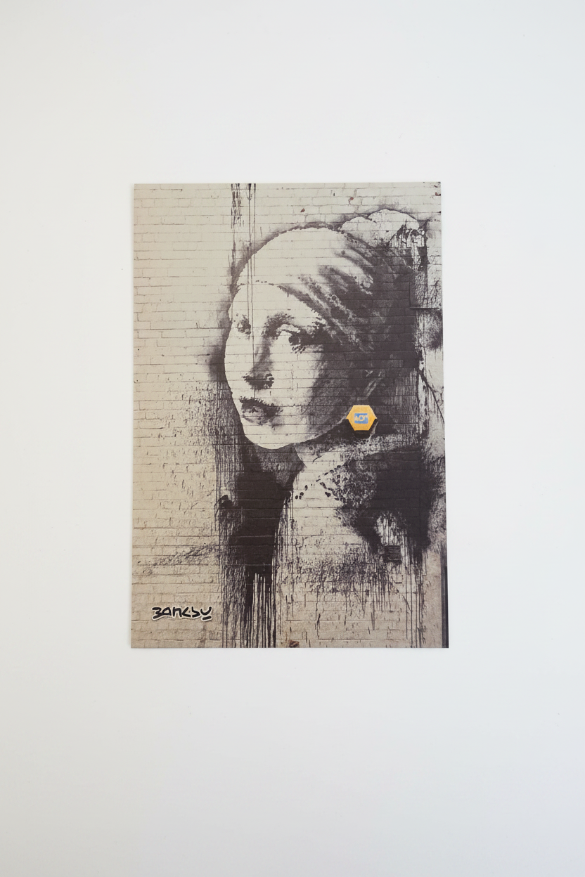 Banksy Girl With Burst Eardrum postcard on white background