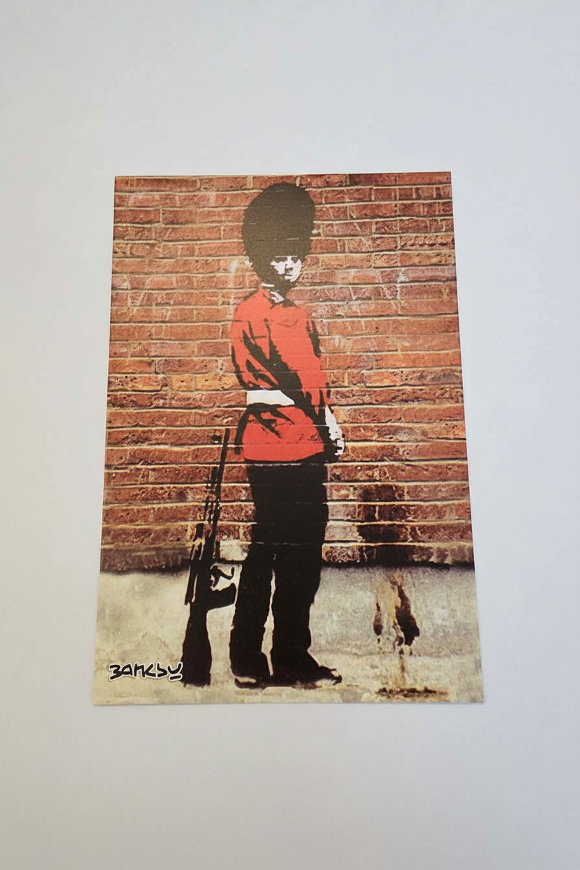 Banksy Pissing Soldier postcard on white background