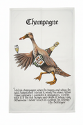 Simon Drew Champagne tea towel flat lay on white background