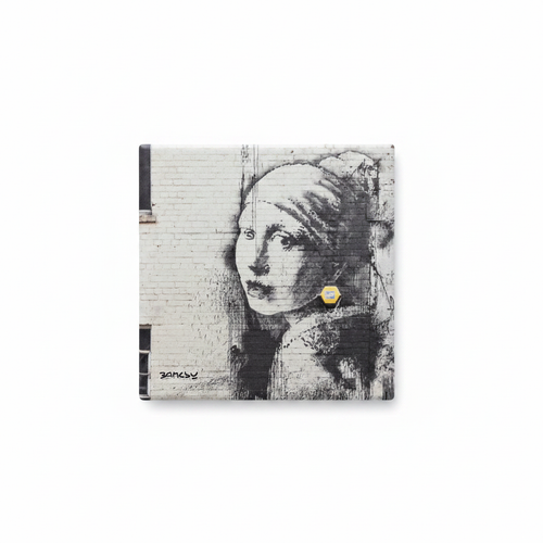 Banksy Girl with Burst Eardrum ceramic coaster flat lay on white background
